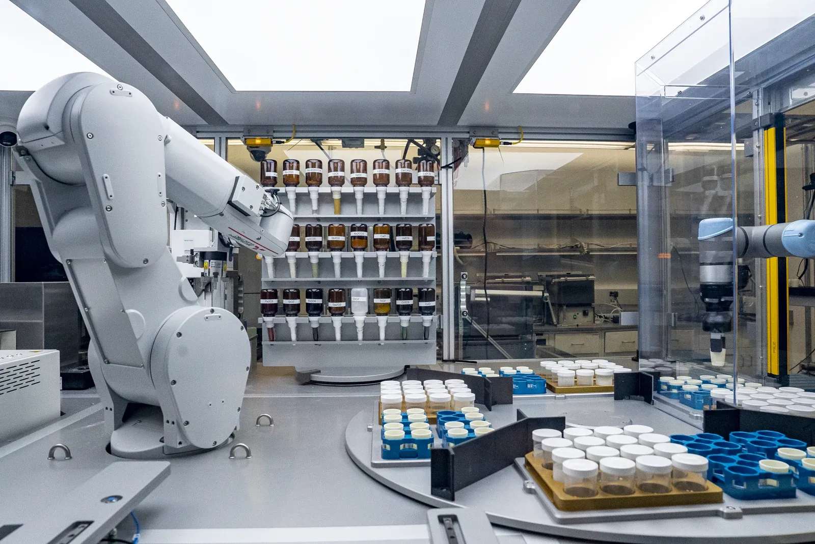 Robotic arms handling sample vials inside UC Berkeley's A-Lab, an autonomous materials-science laboratory